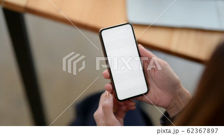 Close up view of a woman using blank screen 62367897