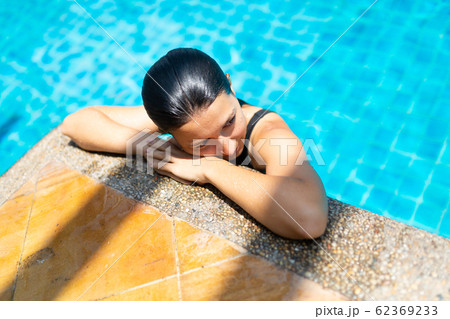 Young sexy slim woman relaxing in tropical 62369233