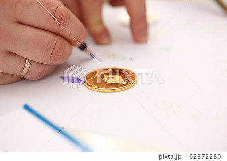 Golden ethereum coin lying at table closeup 62372280