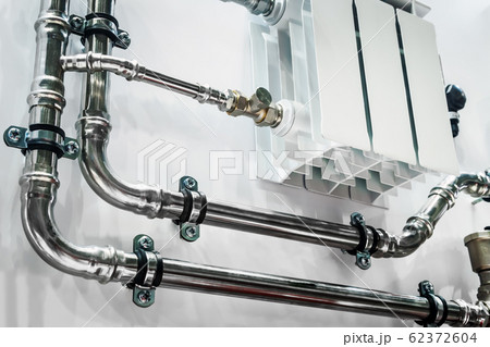 wiring of radiator pipes in the room on the wall wiring of radiator pipes in the room on the wall 62372604