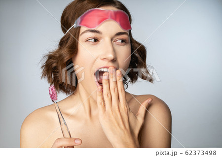 Joyful young female being glad of new day Joyful young female being glad of new day 62373498