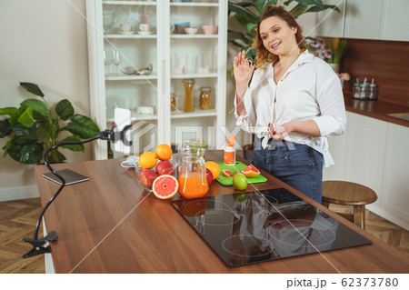 Delighted female person talking about her vitamin complex 62373780