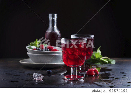 Glasses of a red berry juice 62374195