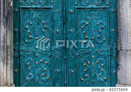 A turquoise metal doors with a beautiful ornament 62375604