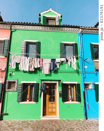 BURANO, ITALY - JANUARY 20, 2020: Colorful houses on the island of Burano in Italy. Burano island is famous for its colorful fisherman's houses. BURANO, ITALY - JANUARY 20, 2020: Colorful houses on the island of Burano in Italy. Burano island is famous for its colorful fisherman's houses. 62376191