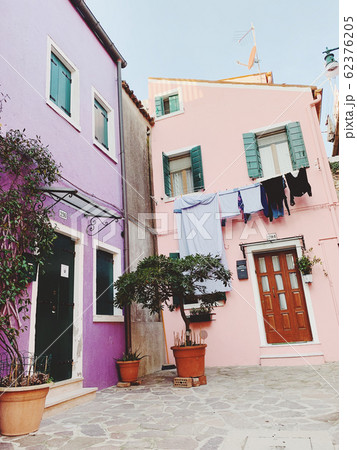 BURANO, ITALY - JANUARY 20, 2020: Colorful houses on the island of Burano in Italy. Burano island is famous for its colorful fisherman's houses. 62376205