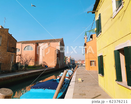 BURANO, ITALY - JANUARY 20, 2020: Colorful houses on the island of Burano in Italy. Burano island is famous for its colorful fisherman's houses. 62376211