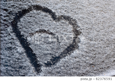 Painted heart on a car windshield Painted heart on a car windshield 62376591