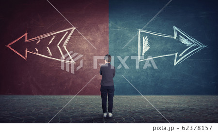 doubtful businesswoman in front of a split wall as 62378157