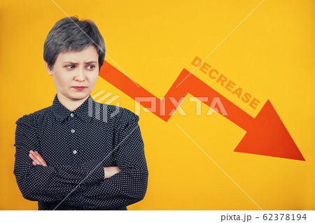 businesswoman looking amazed aside pondering as 62378194