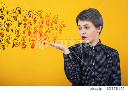 Businesswoman keeps hand raised like receiving a Businesswoman keeps hand raised like receiving a 62378195