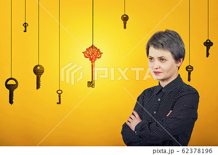 Confident woman keeps hands crossed, looking aside 62378196