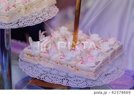 Beautiful fresh cakes on the festive table. Beautiful fresh cakes on the festive table. 62378669