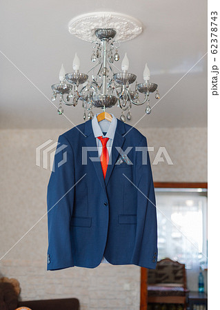 Stylish men's jacket hanging on a hanger. 62378743