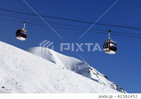 Gondola lift and ski slope 62381452