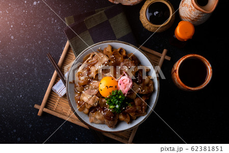 Japanese style rice with simmer pork. 62381851