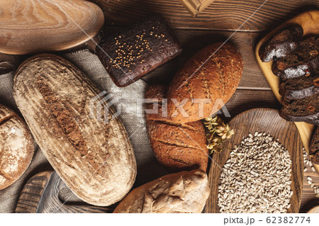 Whole grain multigrain bread, whole and sliced, contains seeds isolated on black Whole grain multigrain bread, whole and sliced, contains seeds isolated on black 62382774