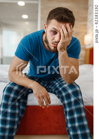 Tired man awake in bed 62383192