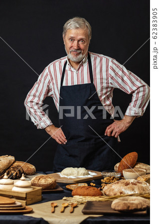 Male senior chef isolated on black background 62383905