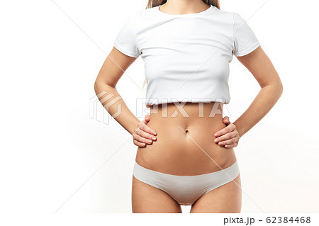 Healthy stomach health concept, early pregnancy concept. Caucasian woman model. 62384468