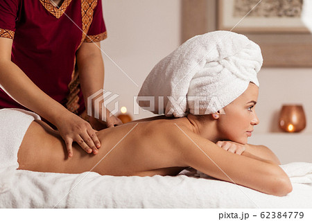 clinical massage therapist helps to woman toの写真素材