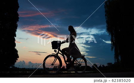 Pretty girl with a blue bike Pretty girl with a blue bike 62385020
