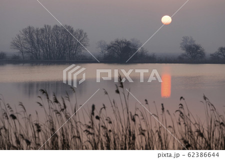 sunrice over Jaroslavice pond, Czech Republic sunrice over Jaroslavice pond, Czech Republic 62386644