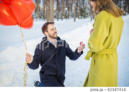 romantic caucasian man making marriage proposal at street romantic caucasian man making marriage proposal at street 62387418