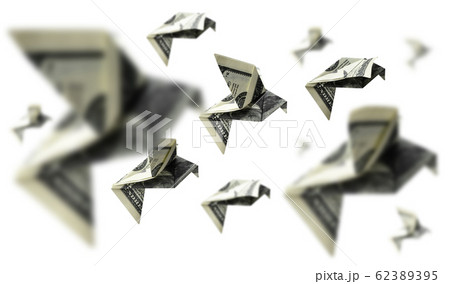 Hundred dollar bills in the shape of birds in flight on a white background 62389395