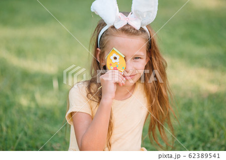 Portrait of kid with easter busket with eggs outdoor Portrait of kid with easter busket with eggs outdoor 62389541