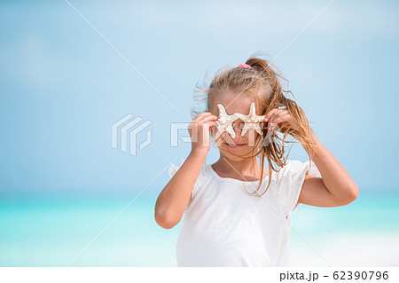 Cute little girl at beach during caribbean vacation Cute little girl at beach during caribbean vacation 62390796