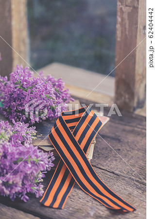 Traditional Saint George ribbon on old books 62404442
