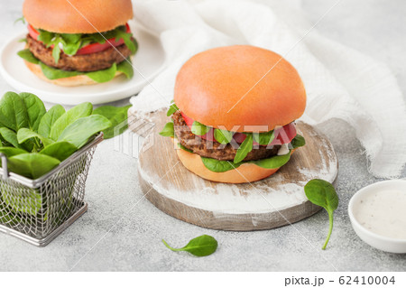 Healthy vegetarian meat free burgers on round 62410004