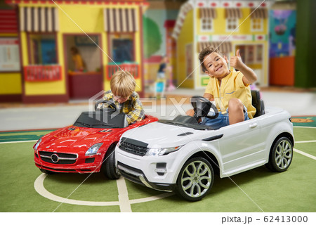Happy little boys having fun at entertainment center. 62413000