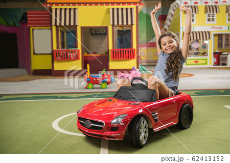 Happy caucasian kid at entertainment center. 62413152