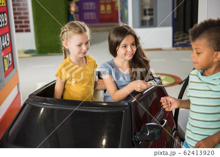 Kids in indoor playroom. 62413920