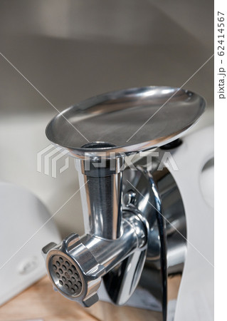 new electric meat grinder closeup new electric meat grinder closeup 62414567