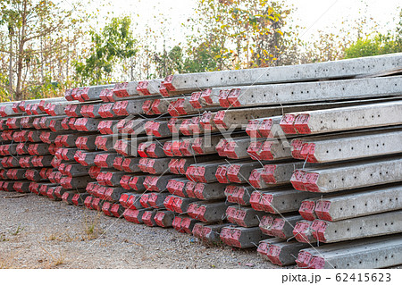 Stacked concrete electric pole on the ground prepare to use Stacked concrete electric pole on the ground prepare to use 62415623