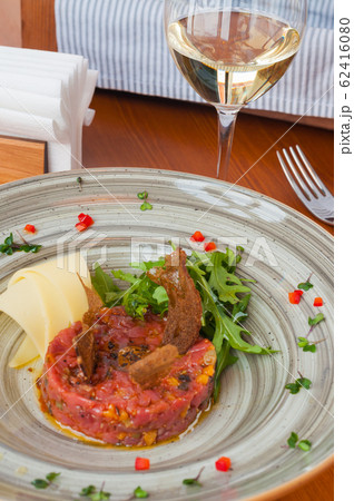 tasty tuna tartare with arugula and Parmesan tasty tuna tartare with arugula and Parmesan 62416080