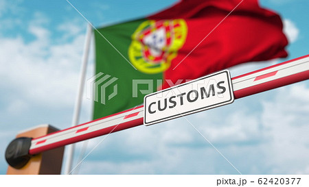 Closed boom gate with CUSTOMS sign on the Portuguese flag background. Border closure or protective tariffs in Portugal. 3D rendering Closed boom gate with CUSTOMS sign on the Portuguese flag background. Border closure or protective tariffs in Portugal. 3D rendering 62420377