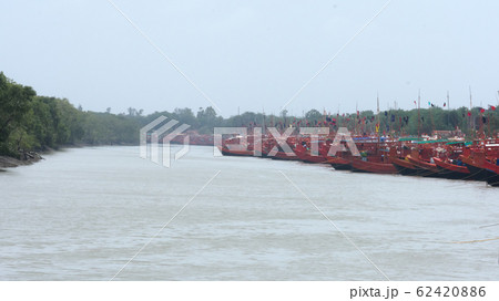 Commercial nautical sea vessels anchored in protected nautical mile zone area. Commercial nautical sea vessels anchored in protected nautical mile zone area. 62420886