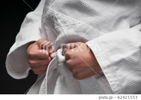 hands closeup - teenager dressed in martial arts hands closeup - teenager dressed in martial arts 62421553