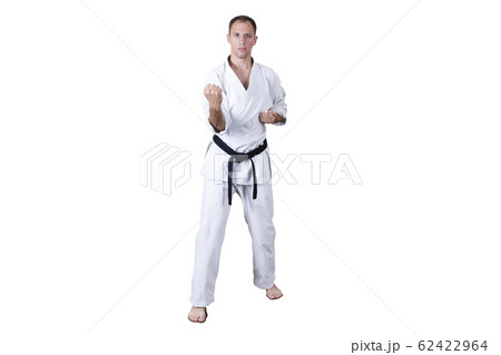 Adult athlete performs formal goju-ryu exercises. 62422964