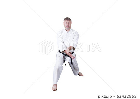 Adult athlete performs formal goju-ryu exercises. 62422965