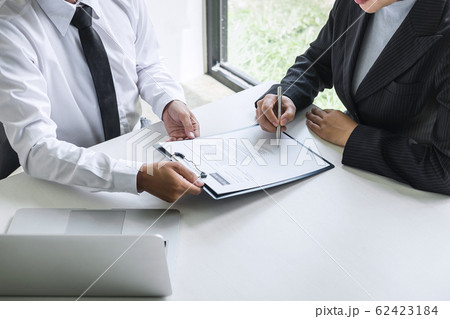 Employer or committee holding reading a resume Employer or committee holding reading a resume 62423184
