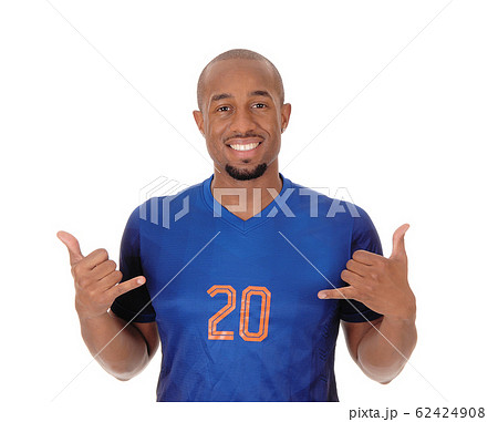 Happy African soccer player pointing at himself 62424908