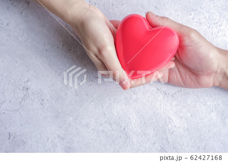 hand carrying heart .love and cardio health hand carrying heart .love and cardio health 62427168