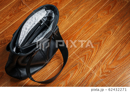 Powerbank charges a smartphone on a pink 62432271