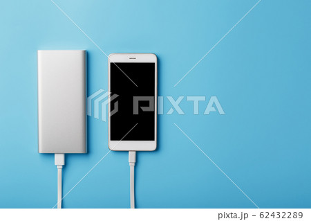 A charging phone with powerbank on blue 62432289