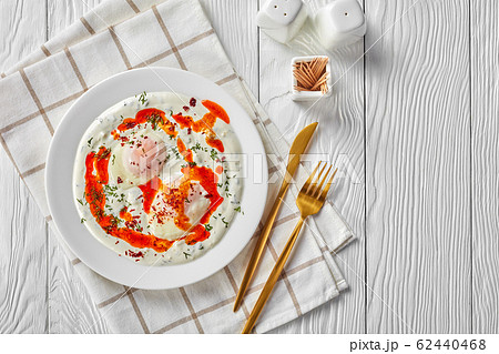 cilbir, poached eggs in dill yogurt sauce cilbir, poached eggs in dill yogurt sauce 62440468